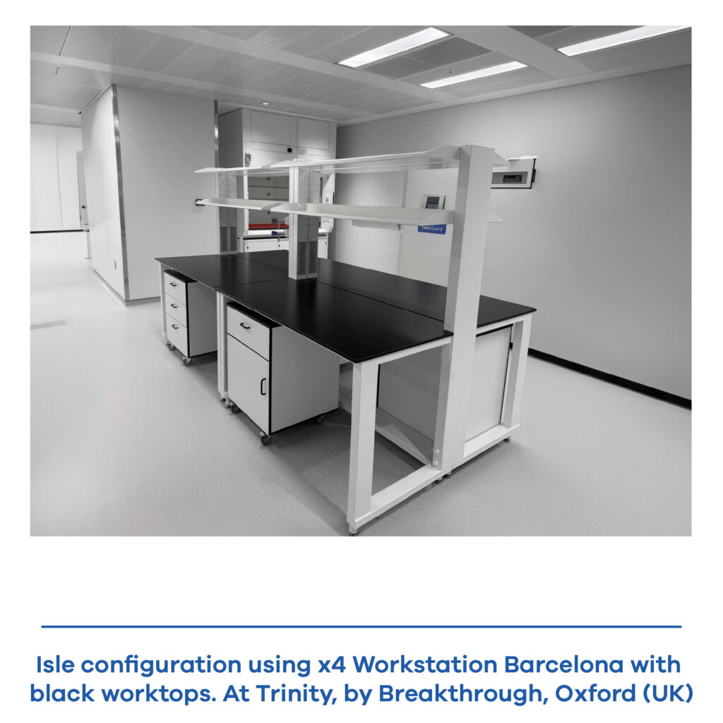 Real laboratory installation featuring multiple Barcelona modular workstations with black worktop, arranged in a complete workspace.